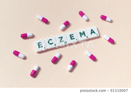 Eczema formed of scrabble tiles and pharmaceutical capsules. 91318007