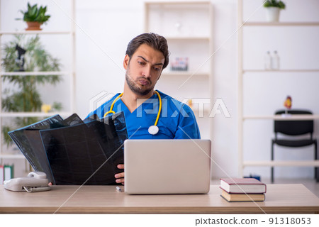 Young male doctor radiologist working in the clinic Young male doctor radiologist working in the clinic 91318053