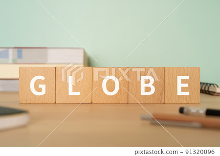 Image of the Earth / Sphere | Desk with a block labeled "GLOBE" 91320096