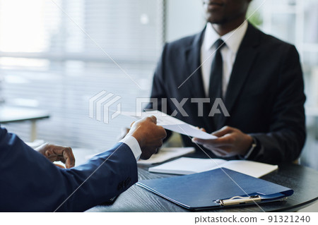 Business Partners Discussing Contract Closeup 91321240