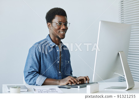 Smiling Professional using Computer Minimal 91321255