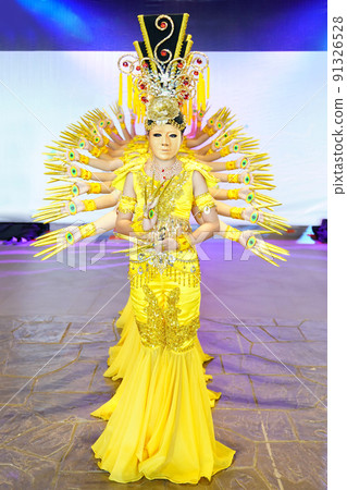 Performance traditional show, with the amazing luxury yellow Indian dress style., They are posting and standing in a row of photo shooting section. Performance traditional show, with the amazing luxury yellow Indian dress style., They are posting and standing in a row of photo shooting section. 91326528