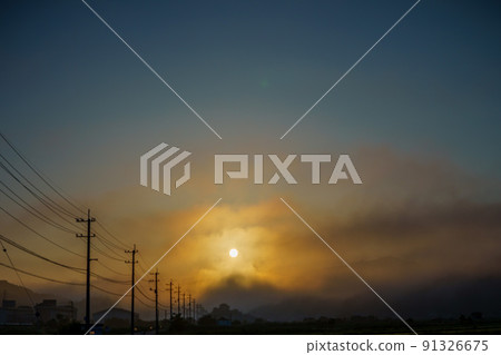 Telephone pole floating in the morning sun 91326675