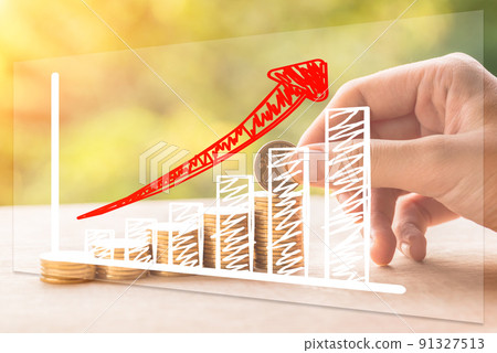 Hand drawn economic growth chart on increasing gold coins 91327513