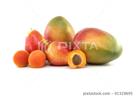 Whole and halved ripe apricot, pear and mango fruit Whole and halved ripe apricot, pear and mango fruit 91329695