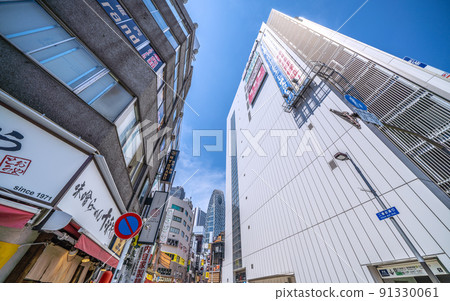 View of Tokyo Mode Gakuen Cocoon Tower in Shinjuku subcenter from Nibangai Street, Tokyo cityscape of Japan View of Tokyo Mode Gakuen Cocoon Tower in Shinjuku subcenter from Nibangai Street, Tokyo cityscape of Japan 91330061