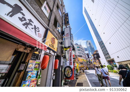 View of Tokyo Mode Gakuen Cocoon Tower in Shinjuku subcenter from Nibangai Street, Tokyo cityscape of Japan 91330062