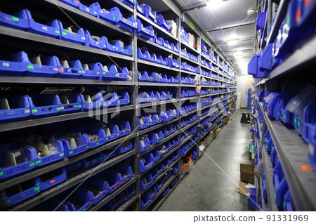 Industrial warehouse. Warehouse of a trade organization. Goods and materials arranged on a rack in warehouse. Warehouse store stock. Industrial warehouse. Warehouse of a trade organization. Goods and materials arranged on a rack in warehouse. Warehouse store stock. 91331969