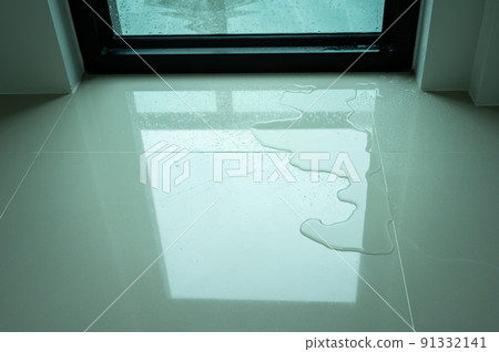 Water leaking on tile floor. Water leaks are often because of pinholes in your plumbing system or small failures in caulking or other exterior materials. Water leaking on tile floor. Water leaks are often because of pinholes in your plumbing system or small failures in caulking or other exterior materials. 91332141