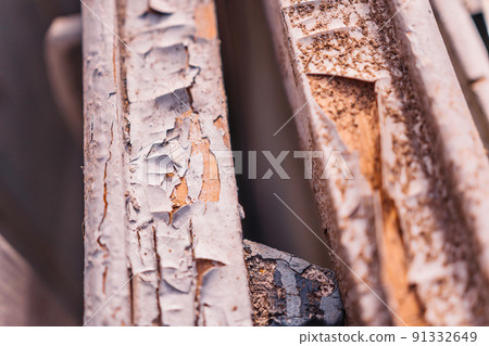 Abstract background, old cracked plaster wall, brown texture, paint stains and cracks. Peeling paint on wood, seamless texture. Pattern of rustic blue grunge material 91332649