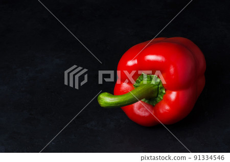 Red pepper on a black background. Paprika. The species capsicum annuum. Copy space Red pepper on a black background. Paprika. The species capsicum annuum. Copy space 91334546