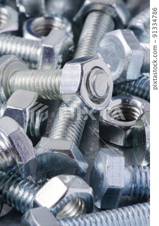 Metal bolts and nuts. Tools for working and fixing. Macrophotography. 91334786