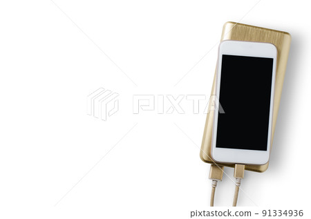 Power Bank charges smartphone. Isolated on a white background. Copy space Power Bank charges smartphone. Isolated on a white background. Copy space 91334936