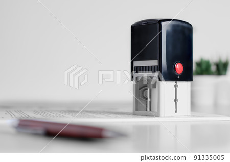 Lawyer or notary accessories. Stamp and fountain pen on the table 91335005