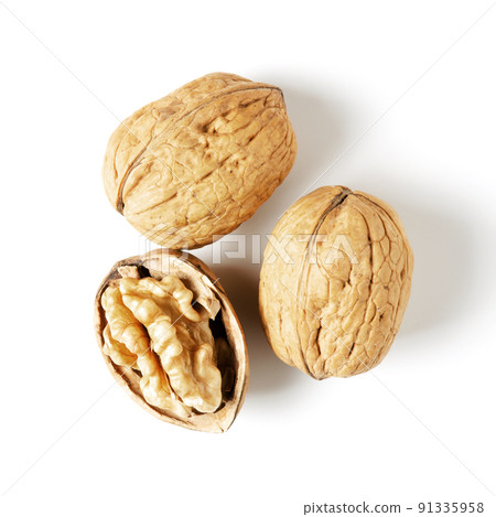 Walnuts on a white background. Nut - a source of vitamins and useful trace elements 91335958