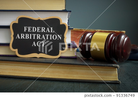 Pile of books and gavel. Federal arbitration act concept. Pile of books and gavel. Federal arbitration act concept. 91336749