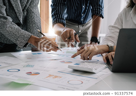 Business people analyzing investment graph meeting brainstorming and discussing plan in meeting room, Startup business investment teamwork concept 91337574