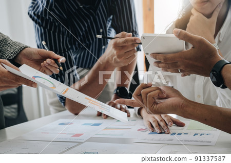 Discussing plan and idea to improvement strategy, businessmen brainstorming for strategy of business investment,businessmen review chart and document of investment information 91337587