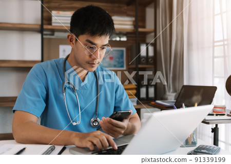 Medical technology concept. Doctor working with mobile phone and stethoscope in modern office. 91339199