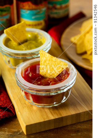 Tortilla chips and dip sauce Tortilla chips and dip sauce 91342546