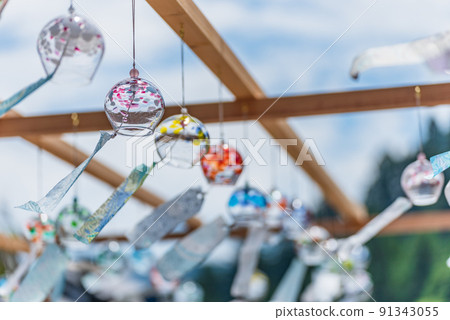 Colorful wind chimes swaying in the wind Fujioka City, Gunma Prefecture 91343055