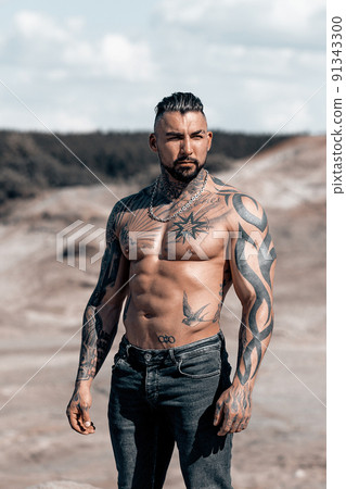 Sexy portrait of muscular handsome topless male model at the beach 91343300