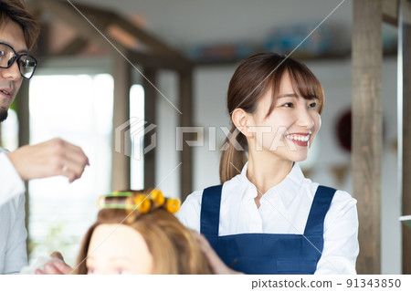 Young staff and teachers practicing perms 91343850