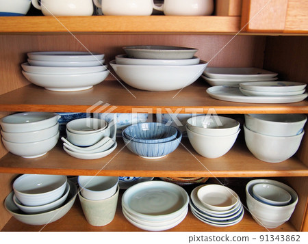 Tableware lined up in the cupboard Tableware lined up in the cupboard 91343862