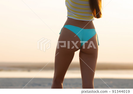 Slim woman with perfect body on beach Slim woman with perfect body on beach 91344019