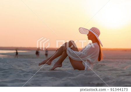 Sensual model in beachwear on sandy shore Sensual model in beachwear on sandy shore 91344173
