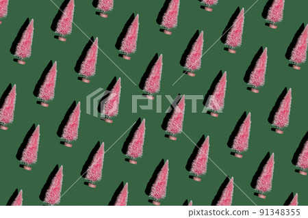 Christmas pattern of pink Christmas trees on green background. Christmas pattern of pink Christmas trees on green background. 91348355