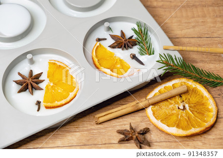 DIY scented soy wax sachet with orange slices, clove spice, spruce and orange essential oils. Winter fresh wax sachet DIY scented soy wax sachet with orange slices, clove spice, spruce and orange essential oils. Winter fresh wax sachet 91348357