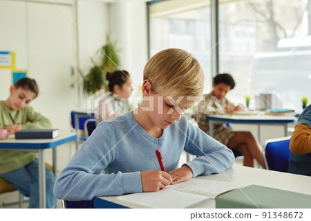 Young Boy Studying in Class Young Boy Studying in Class 91348672