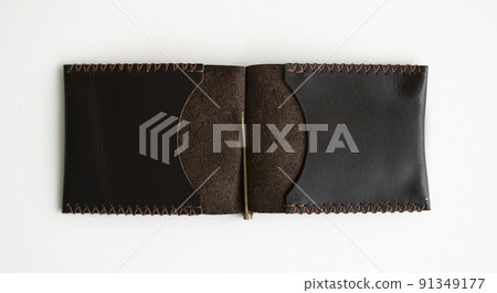 Men's business genuine leather money clip on a white surface. Accessories. 91349177