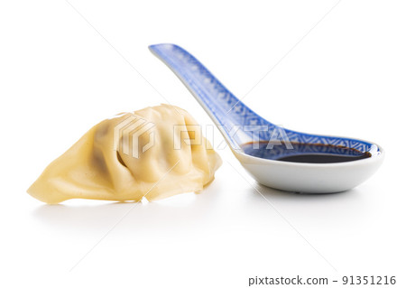 Chinese dumplings and soy sauce isolated on white background. 91351216
