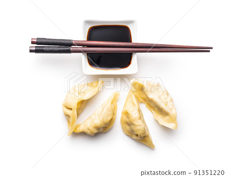 Chinese dumplings and soy sauce isolated on white background. Chinese dumplings and soy sauce isolated on white background. 91351220
