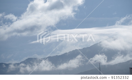 Mountain after the rain where water vapor rises Mountain after the rain where water vapor rises 91352332