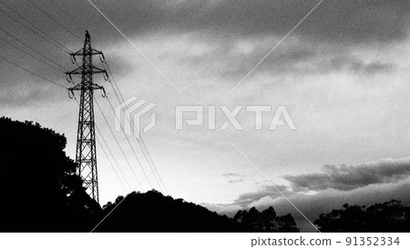 A high-voltage power line tower that feels like a storm or a monster is coming A high-voltage power line tower that feels like a storm or a monster is coming 91352334