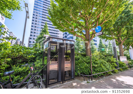 Tokyo cityscape of Japan Cityscape of Shinjuku subcenter ... Telephone box ... (The left back is Kogakuin University Shinjuku campus) 91352698
