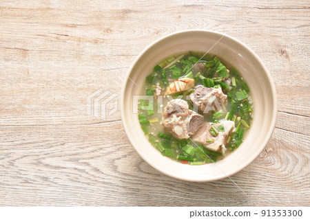 hot and spicy pork bone with tamarind and Thai herbs soup on bowl  91353300