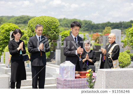 Bereaved family attending the bone-laying ceremony 91356246