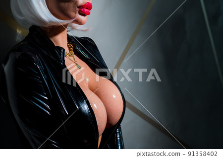 Sexy woman in a blonde wig and latex catsuit.... - Stock Photo [91358402] -  PIXTA