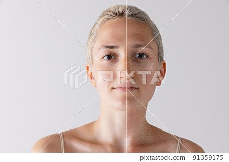 Comparative portrait of woman with smooth young face and aging wrinkled skin isolated over grey studio background 91359175