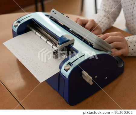 Blind woman using braille typewriter. Blind woman using braille typewriter. 91360305
