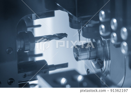 The multi-tasking CNC lathe machine swiss type hole drilling on the metal parts. The multi-tasking CNC lathe machine swiss type hole drilling on the metal parts. 91362197