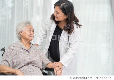 Doctor help and care Asian senior or elderly old lady woman patient sitting on wheelchair at nursing hospital ward, healthy strong medical concept 91365586
