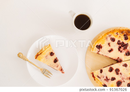 Piece cut from whole cherry pie on wooden board on pink background 91367026