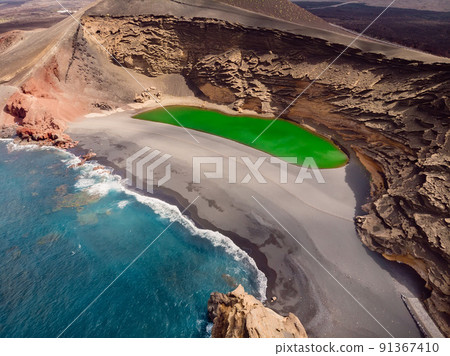 Scenic lanscape with volcanic crater with green lake in El Golfo, Lanzarote. Aerial view Scenic lanscape with volcanic crater with green lake in El Golfo, Lanzarote. Aerial view 91367410