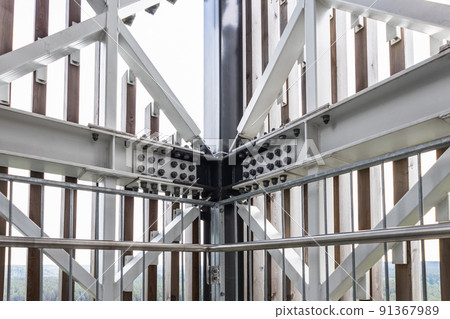 Massive industrial steel construction end-to-end with bolts and nuts on the construction 91367989