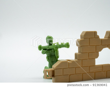 Soldier hiding in the wall and shooting Soldier hiding in the wall and shooting 91369041